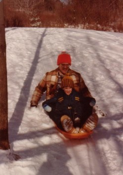 Brian and his Dad sledding